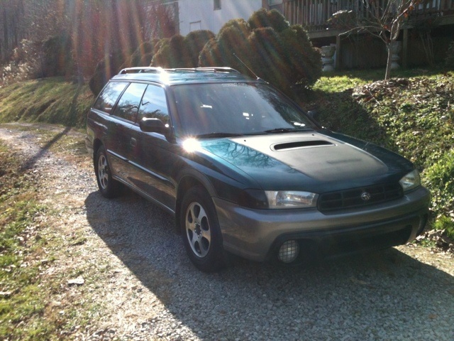 Latest mods to the outside include custom plasti-dip paintwork, turn signal light tinting, and oversized mudflaps. The plasti-dip on the hood was recently removed with just the inside of the hood scoop remaining painted.